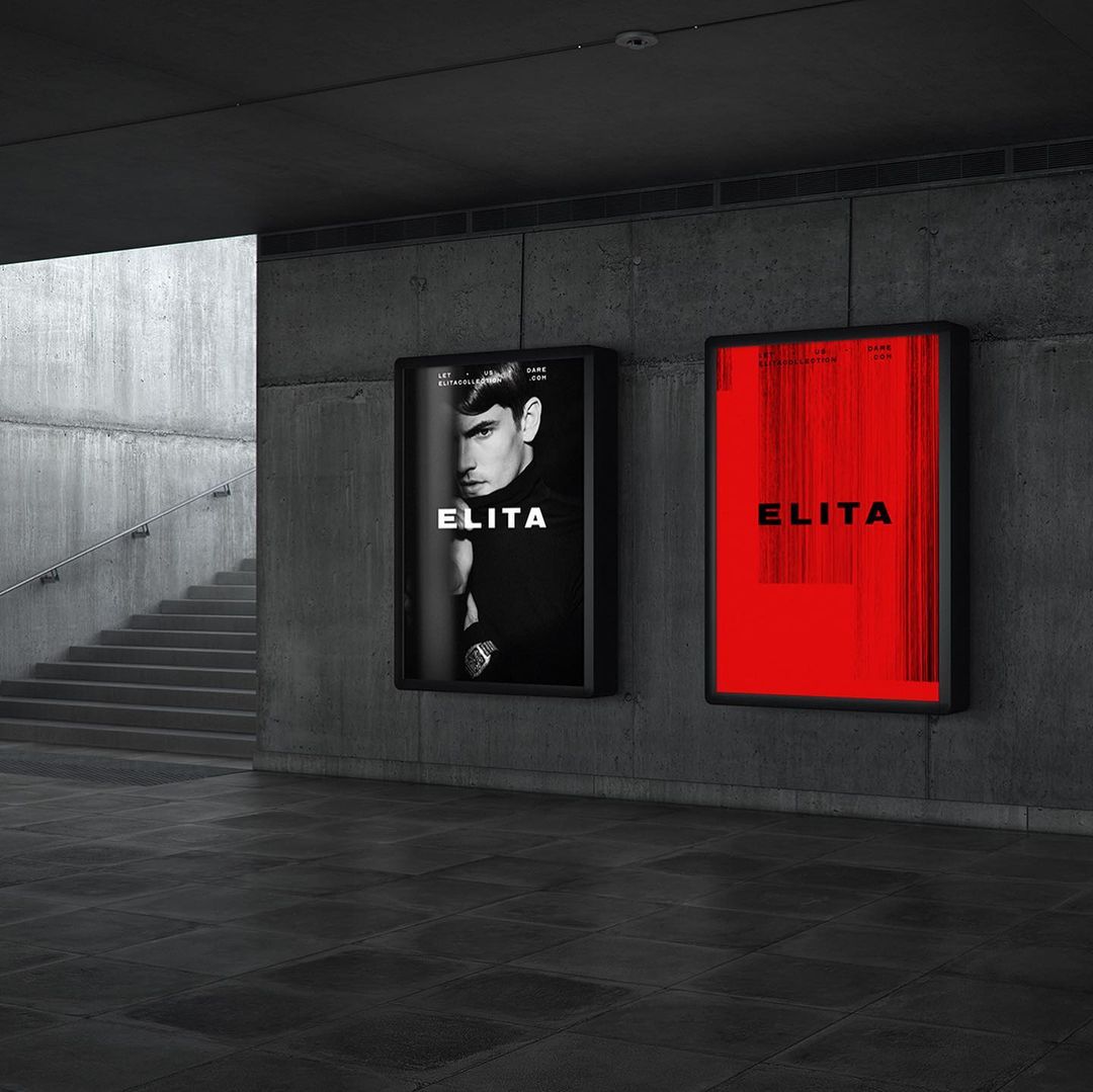 Two 'Elita' advertisements hang on a textured grey wall, one in black and white with a male model, the other in bright red.
