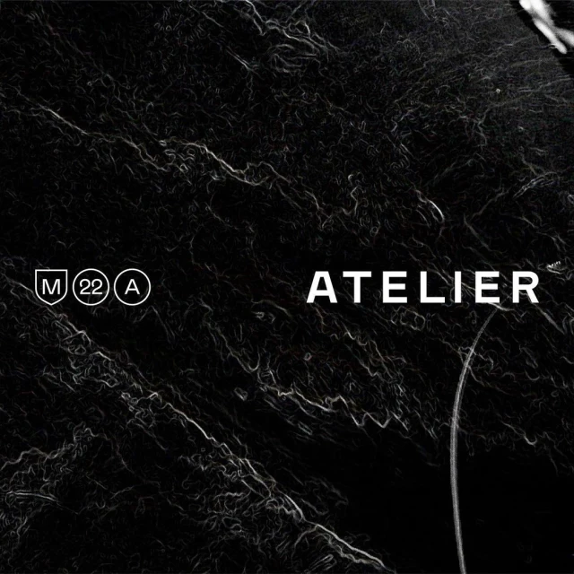 Abstract dark background with swirling textures and prominent Atelier text, creating a sophisticated visual experience.