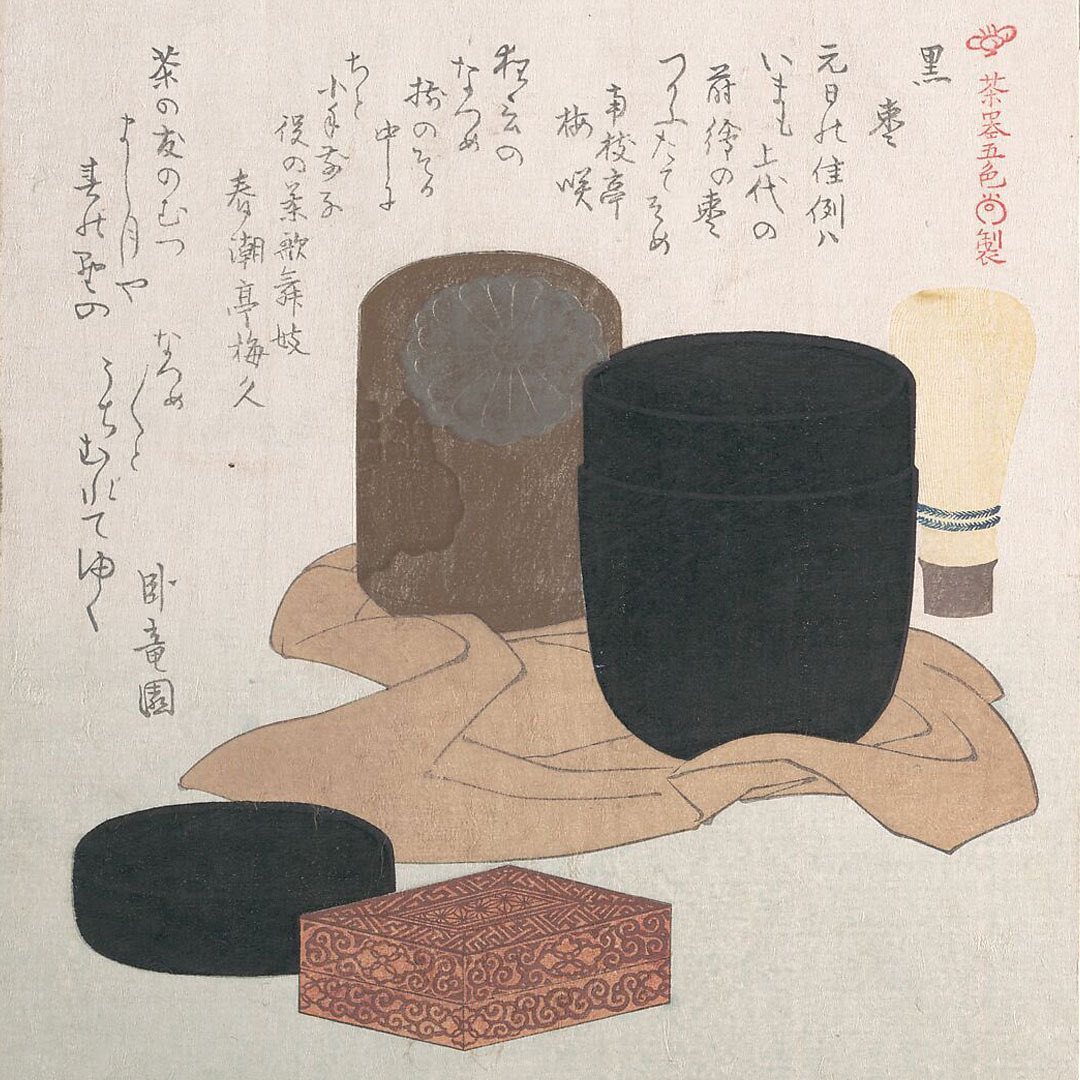 Still life of traditional Japanese tea ceremony items arranged on a cloth, including a tea caddy, a box, and a ceramic container.