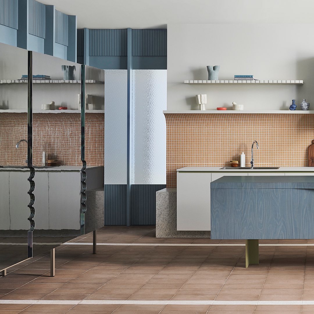 Interior design of a kitchen features modern cabinetry in blue and white, a tile backsplash, and minimalist shelves with decor.