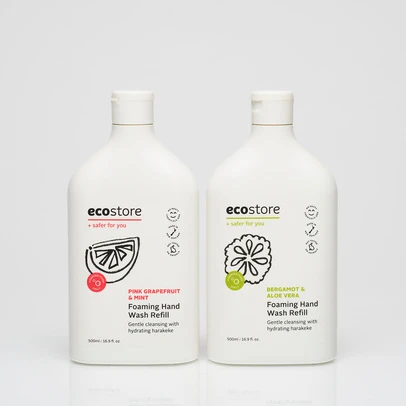 Two white plastic bottles of Ecostore foaming hand wash refill with pink grapefruit and bergamot aloe vera, against a white backdrop.