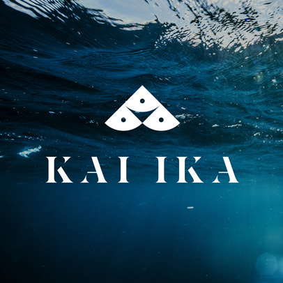 Underwater shot of a logo with wave patterns in shades of blue and white, centered, beneath the surface of the ocean.