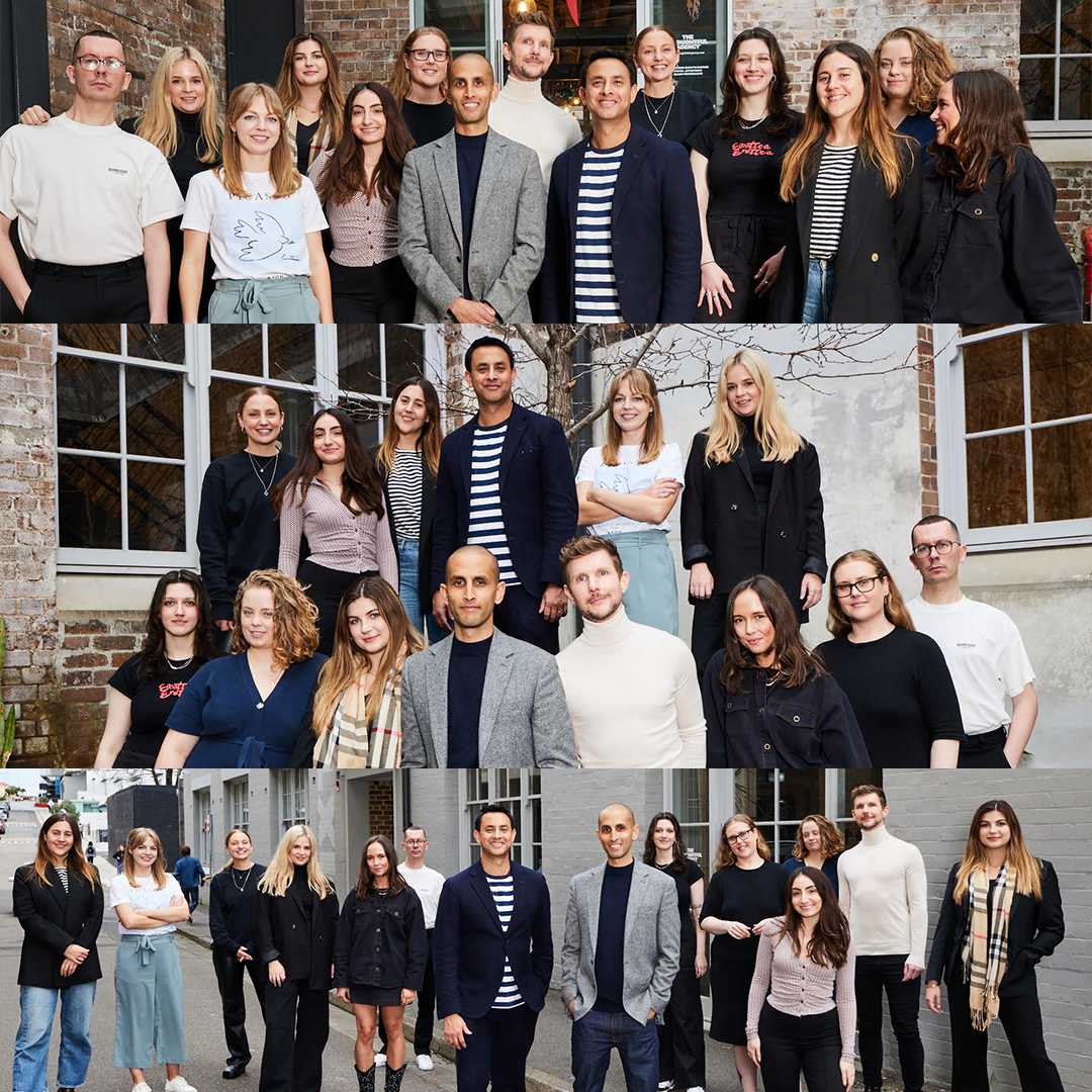 Outdoor group portrait of diverse adults in casual dress in front of a brick building with neutral color palette.
