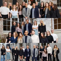 Group portrait of a diverse creative team standing together outside a building in Sydney