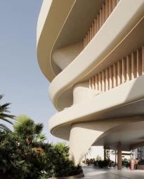Low-angle view of a modern architectural building with curved balconies and lush tropical plants in Sydney