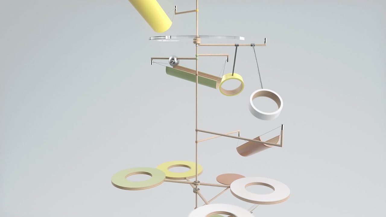 Abstract kinetic sculpture featuring geometric shapes and a balanced design, suspended against a neutral background.