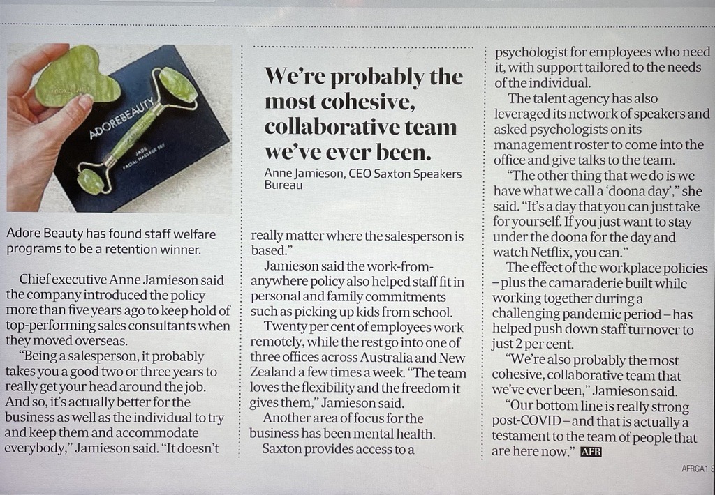 Ad for Adore Beauty featuring a jade facial massage set and gua sha stone, placed on a black box, next to a newspaper article.