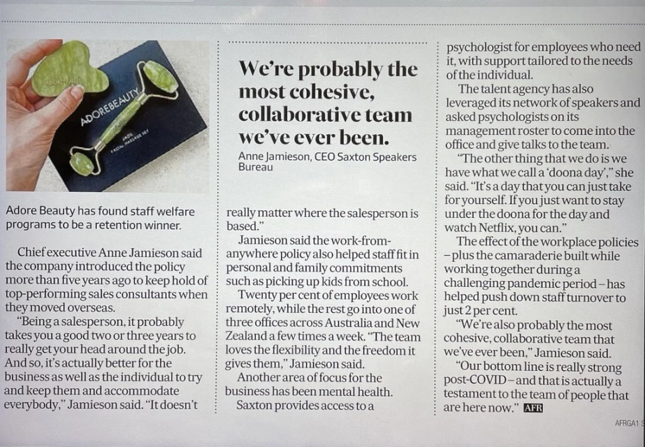Ad for Adore Beauty featuring a jade facial massage set and gua sha stone, placed on a black box, next to a newspaper article.