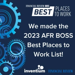 Digital graphic featuring blue gears and bold white typography on a dark blue background celebrating a workplace award.
