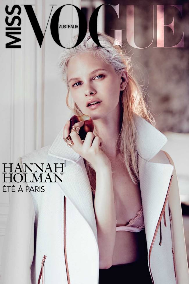 Vogue Australia magazine cover featuring model Hannah Holman in white jacket, holding fruit, soft lighting, and modern design.
