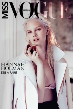 Vogue Australia magazine cover featuring model Hannah Holman in white jacket, holding fruit, soft lighting, and modern design.