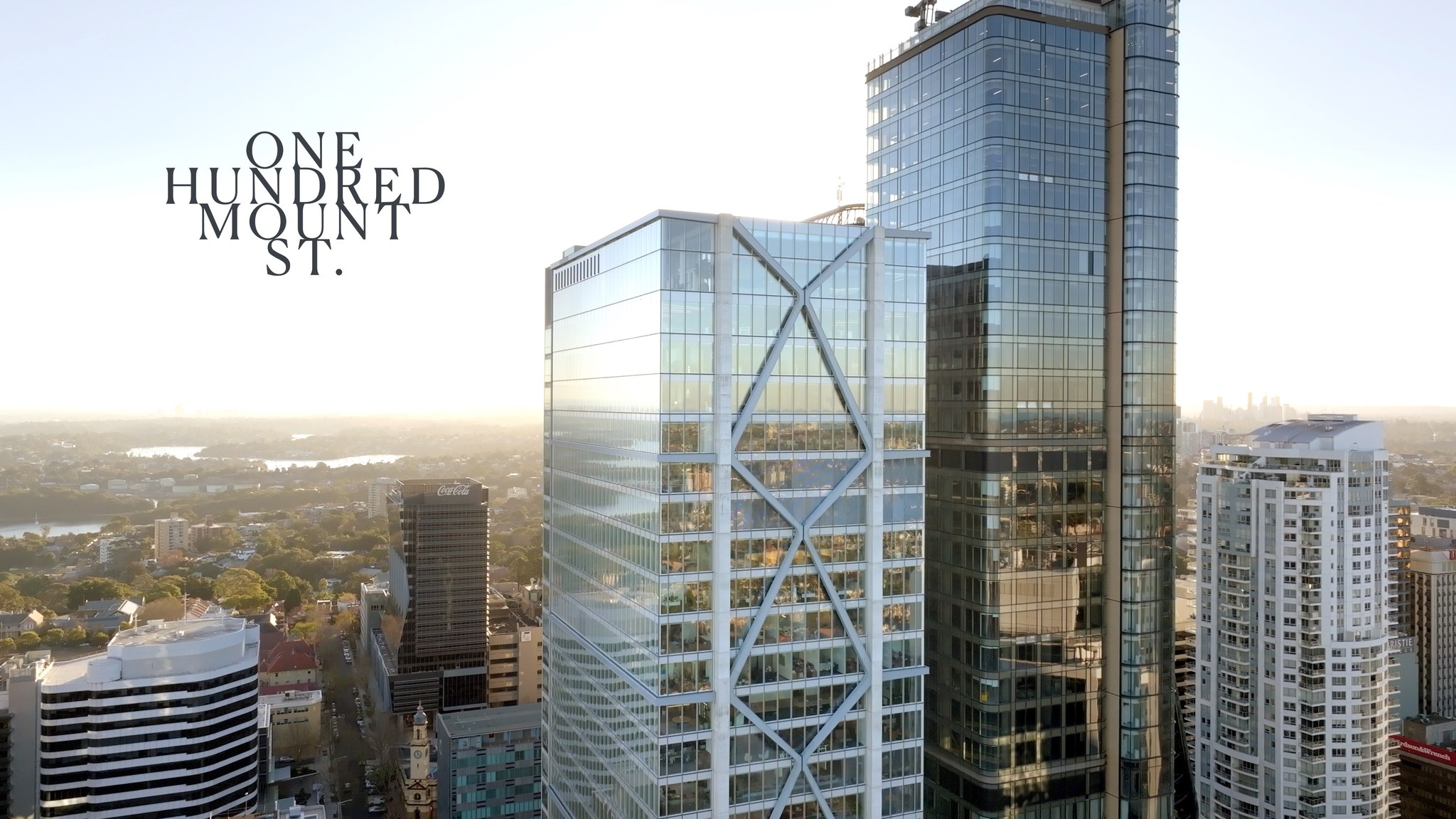 Aerial cityscape of modern high-rise buildings in Sydney, Australia, featuring architectural glass skyscrapers, urban landscape, and skyline.