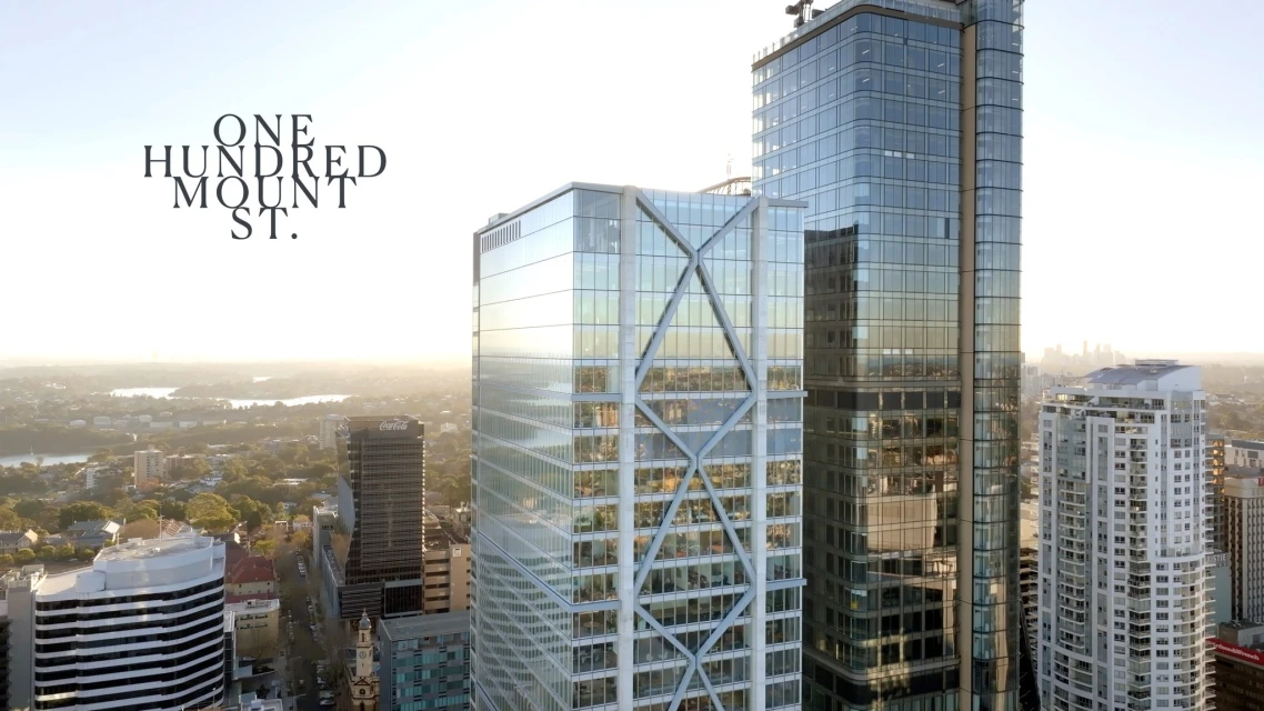 Aerial cityscape of modern high-rise buildings in Sydney, Australia, featuring architectural glass skyscrapers, urban landscape, and skyline.