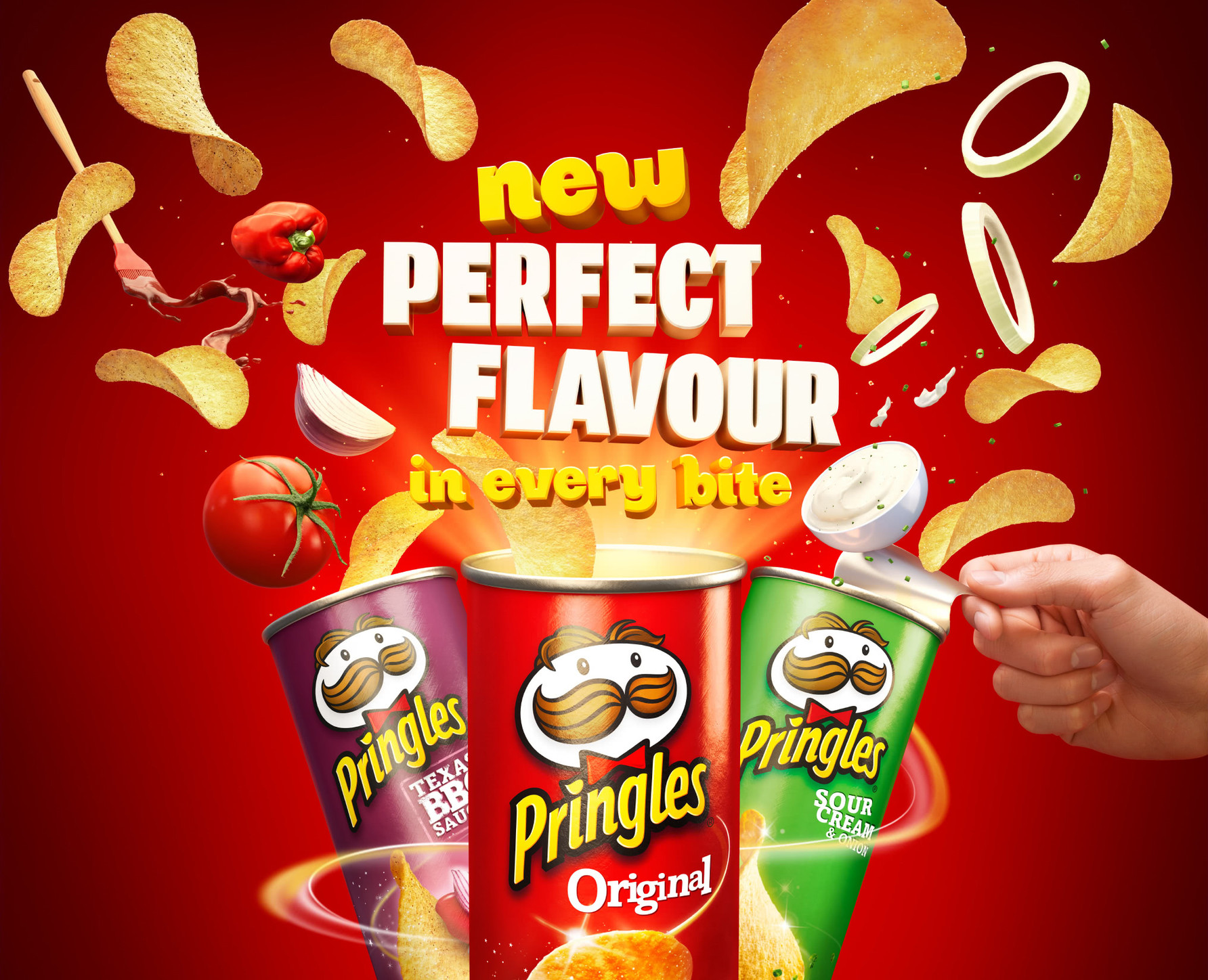 Three Pringles cans with potato chips and various toppings floating around on a bright red background. Food and beverage theme.
