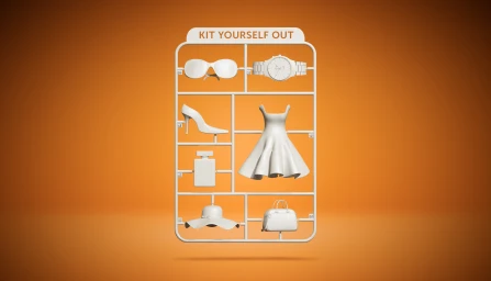 A white plastic model kit frame featuring miniature fashion accessories like sunglasses, a watch, a dress, and a handbag against an orange backdrop