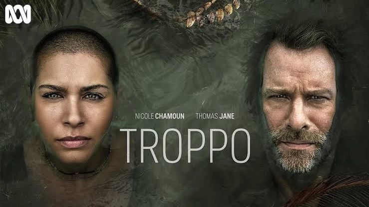 Movie poster for Troppo featuring Nicole Chamoun and Thomas Jane emerging from dark water, promoting the crime thriller show.