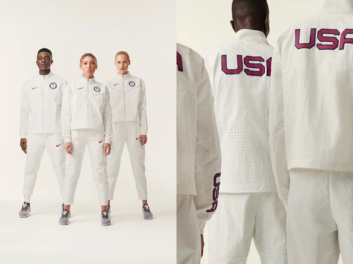 Three models wearing matching white USA tracksuits against a white studio background