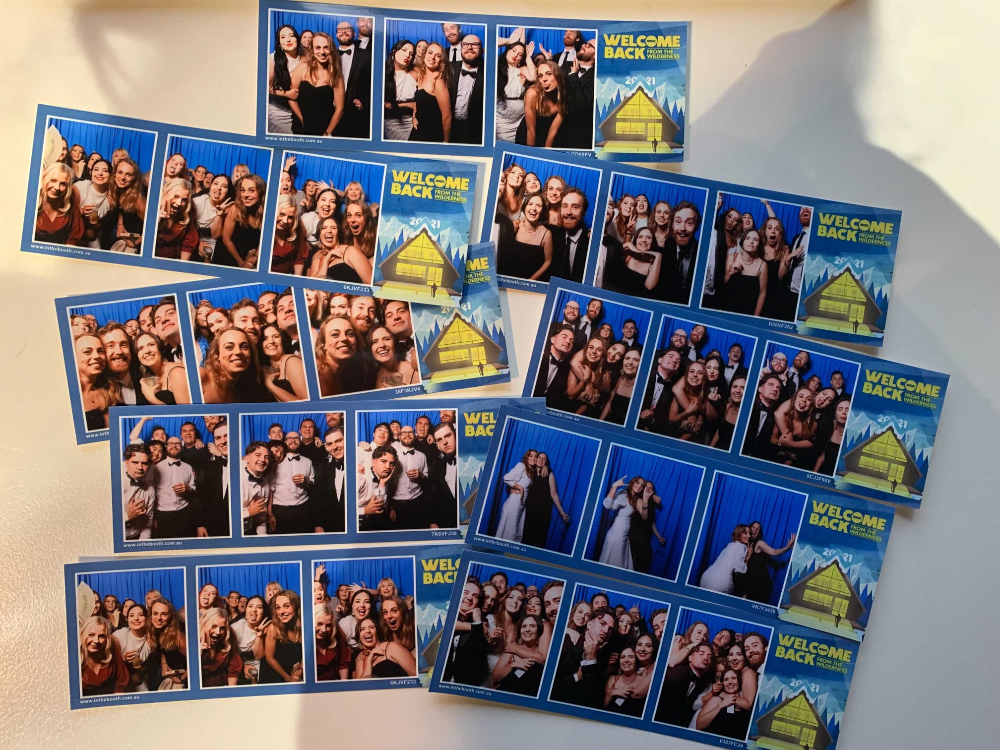 Multiple photo strips with groups of people posing against a blue backdrop, promoting 'Welcome Back' events, creating a collage effect.