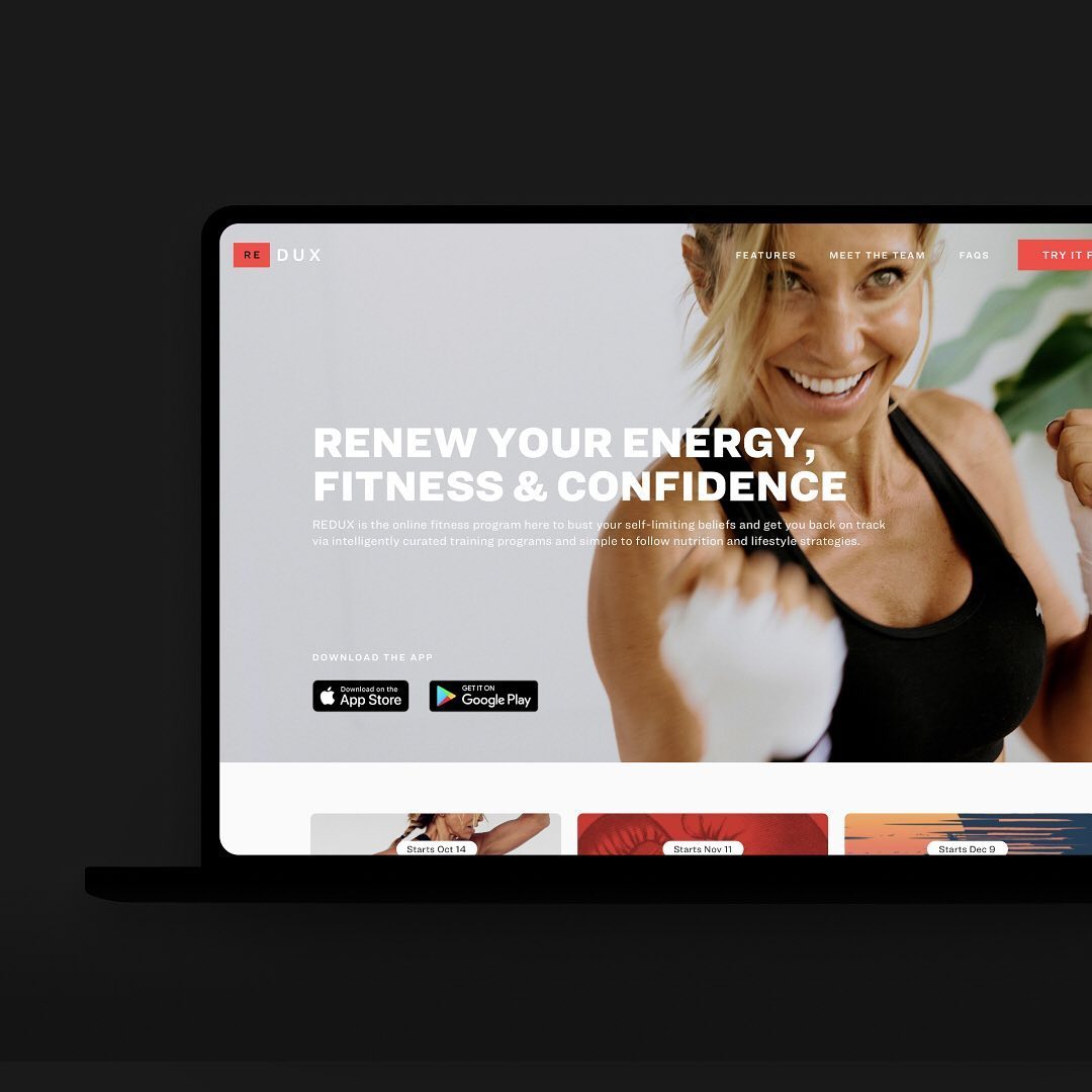 Laptop displaying a fitness website featuring a smiling woman in workout gear; motivational text highlights energy, fitness, and confidence.
