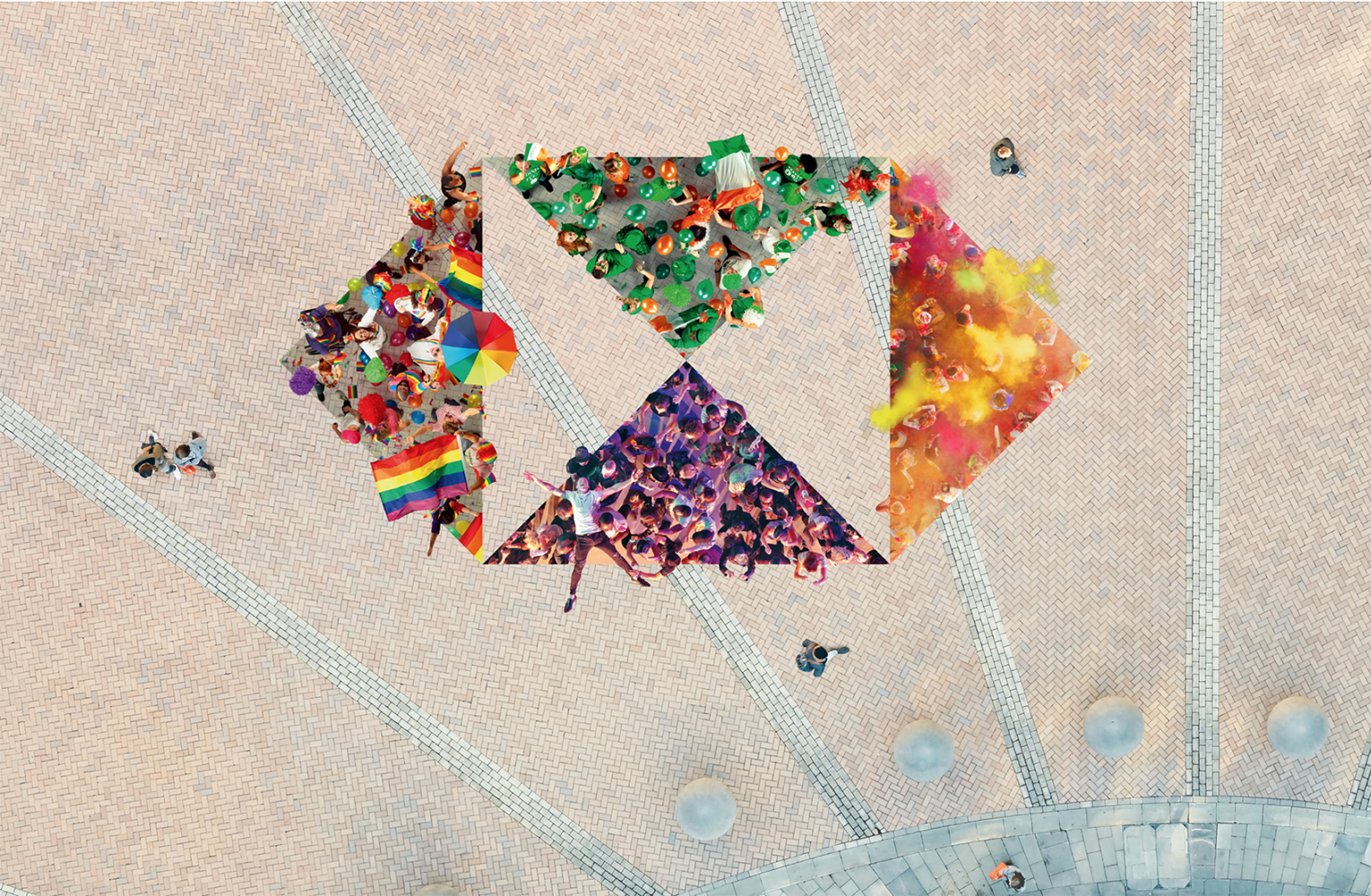 Overhead view of groups of people in a public square, arranged into geometric shapes with rainbow flags, green balloons, and colored powder.