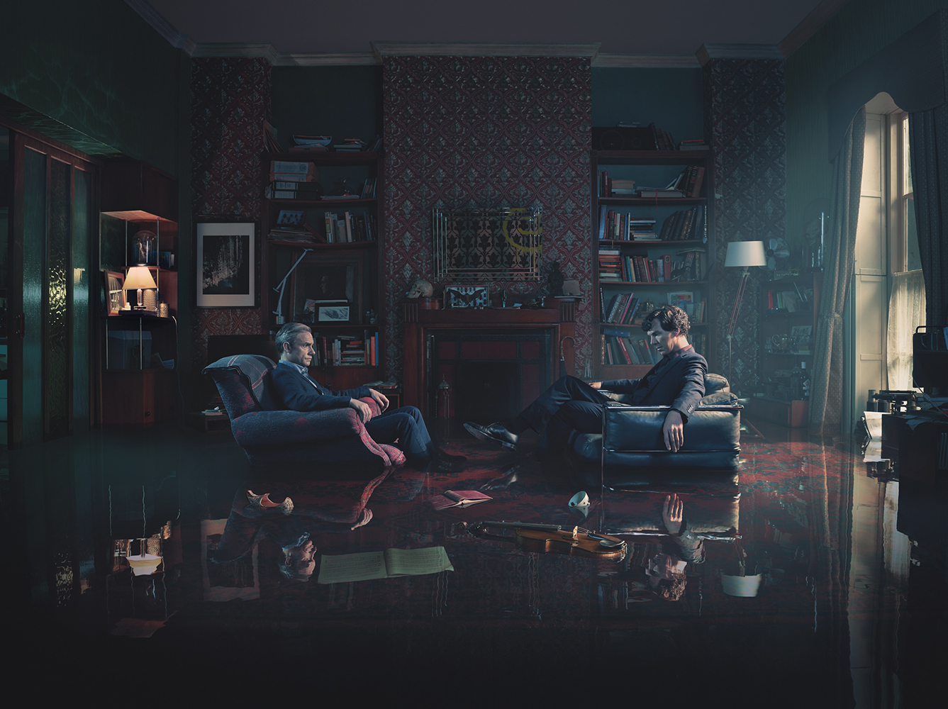 Two men sit facing each other in armchairs in an ornate, dimly lit room with bookshelves, a fireplace, and a reflective floor.