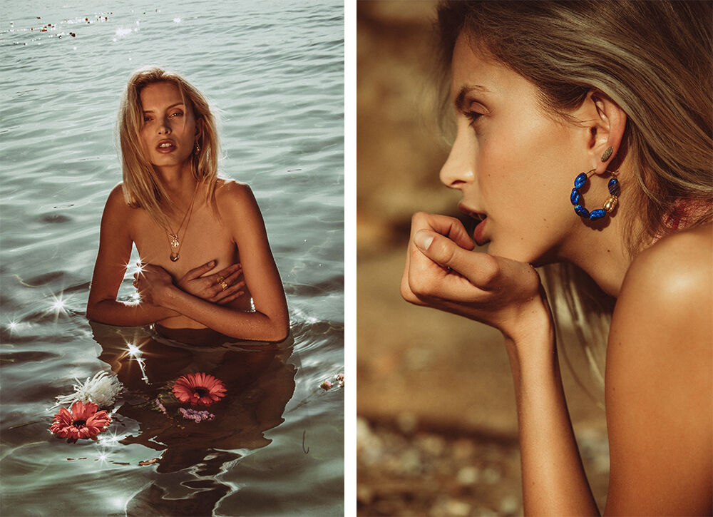 Woman in water with flowers, jewelry close-up. Beauty shot featuring blonde hair, blue and gold earrings, water, and natural light.