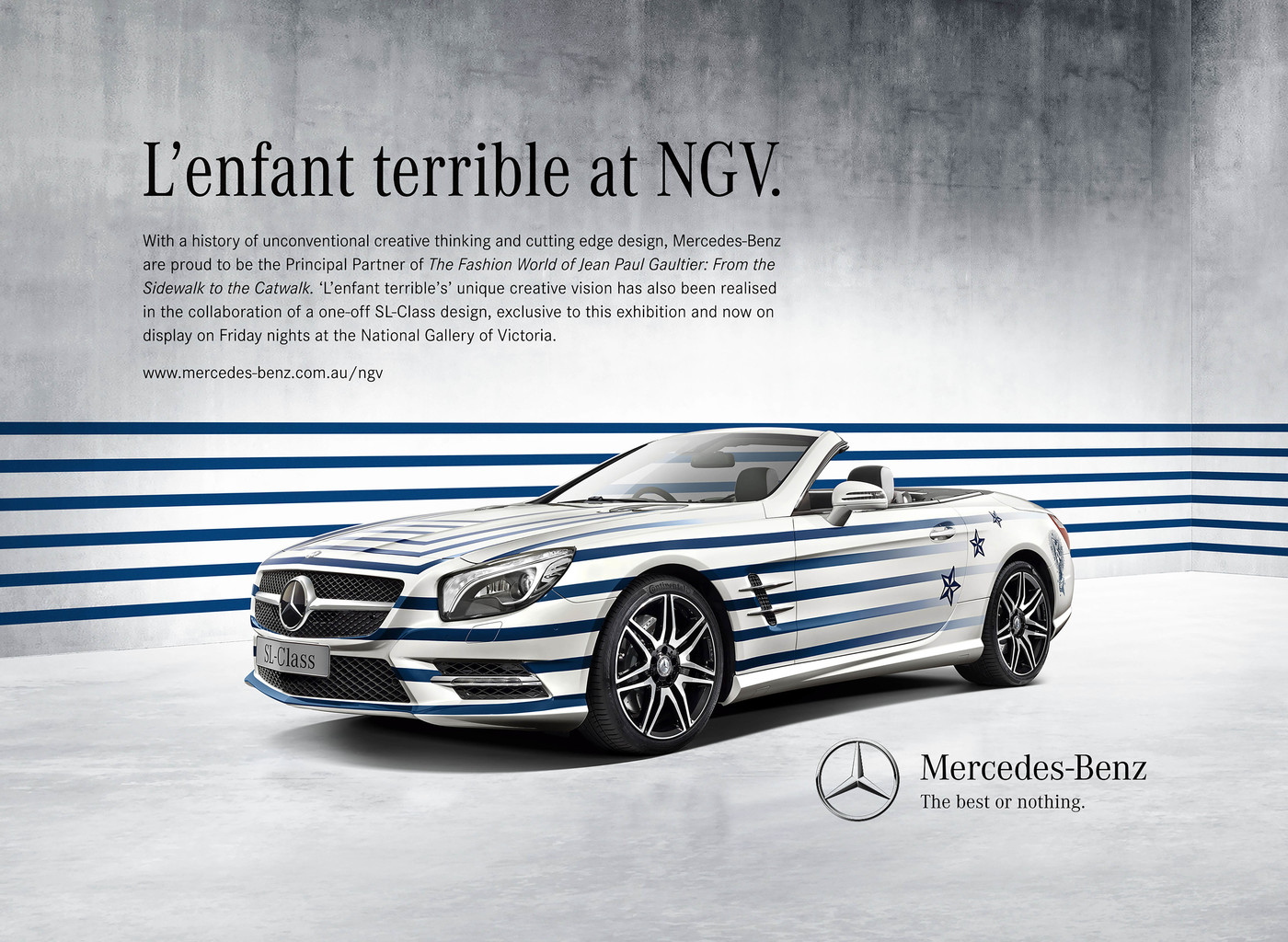 Mercedes-Benz SL-Class with Jean Paul Gaultier-inspired blue and white stripe design, displayed in front of a concrete-textured wall.