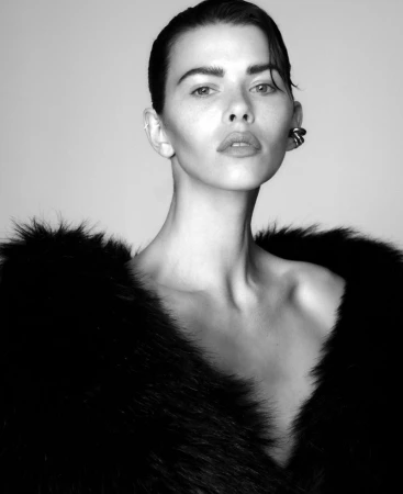 Monochrome portrait of a woman wearing a dark faux fur collar and modern ear cuff in Sydney