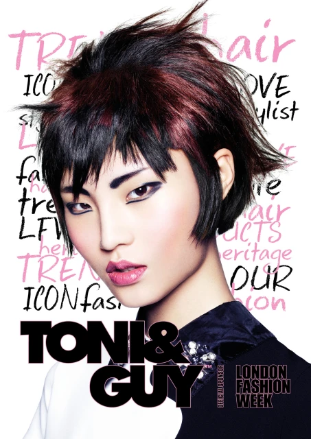 Close-up fashion shot: Asian woman with edgy black/red hair, glossy lips, in stylish black and white jacket against a white backdrop with graphic text.