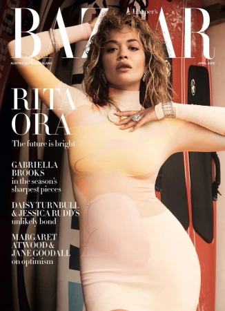 Magazine cover featuring Rita Ora in a form-fitting dress, with surfboards in the background and the 'BAZAAR' logo prominently displayed.