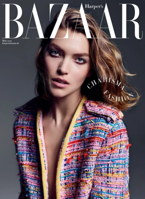 Harper's Bazaar magazine cover featuring a model in a colorful tweed jacket against a grey backdrop, showcasing fashion and beauty.