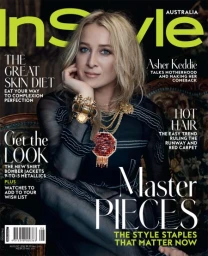 Asher Keddie on InStyle Australia magazine cover wearing layered gold necklaces and a black sheer patterned top