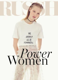 A female model wearing a white t-shirt and sheer tiered skirt against a plain background with magazine title overlays.