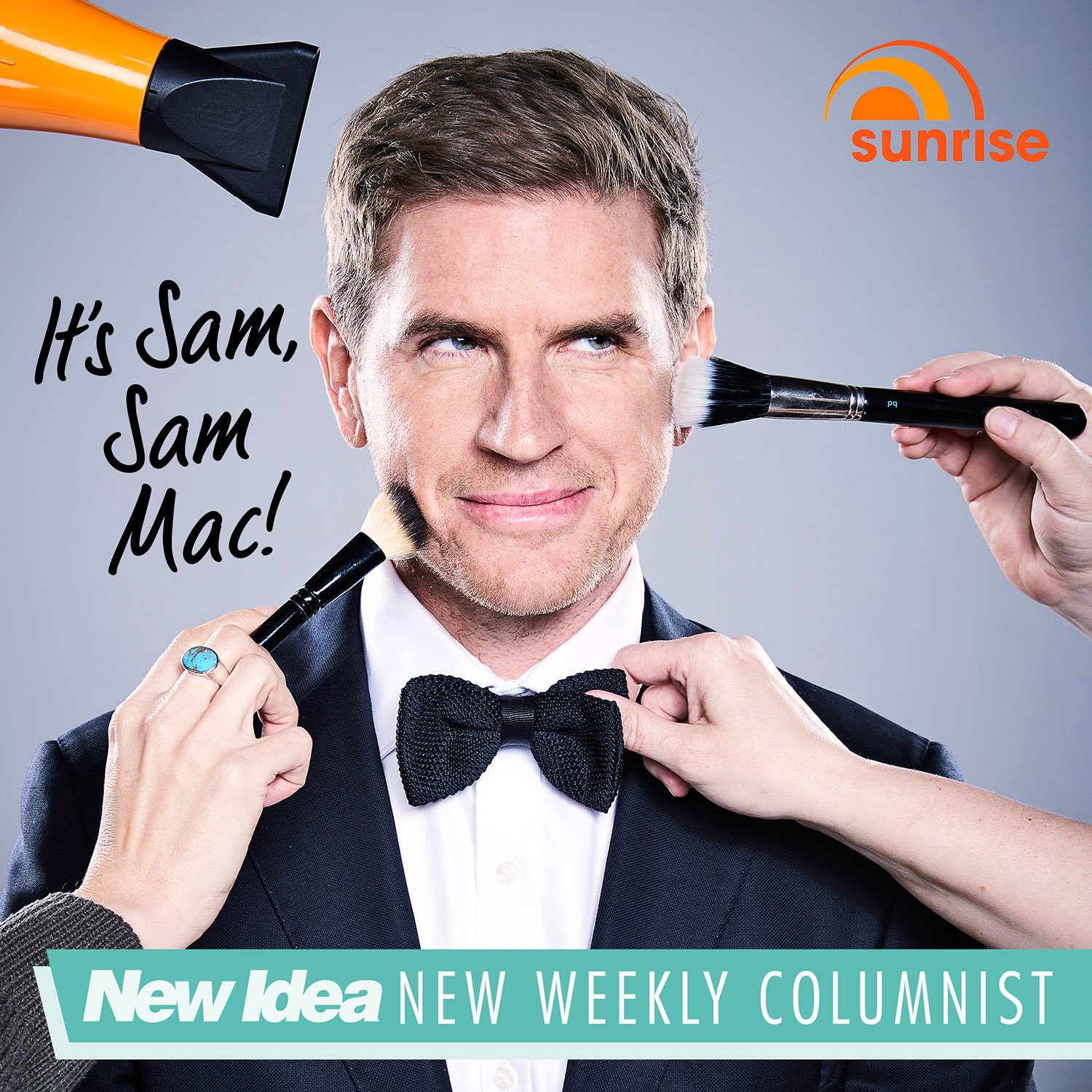 Close-up studio shot of a man in a suit and bow tie having makeup applied to his face, with sunrise logo in the upper right corner.