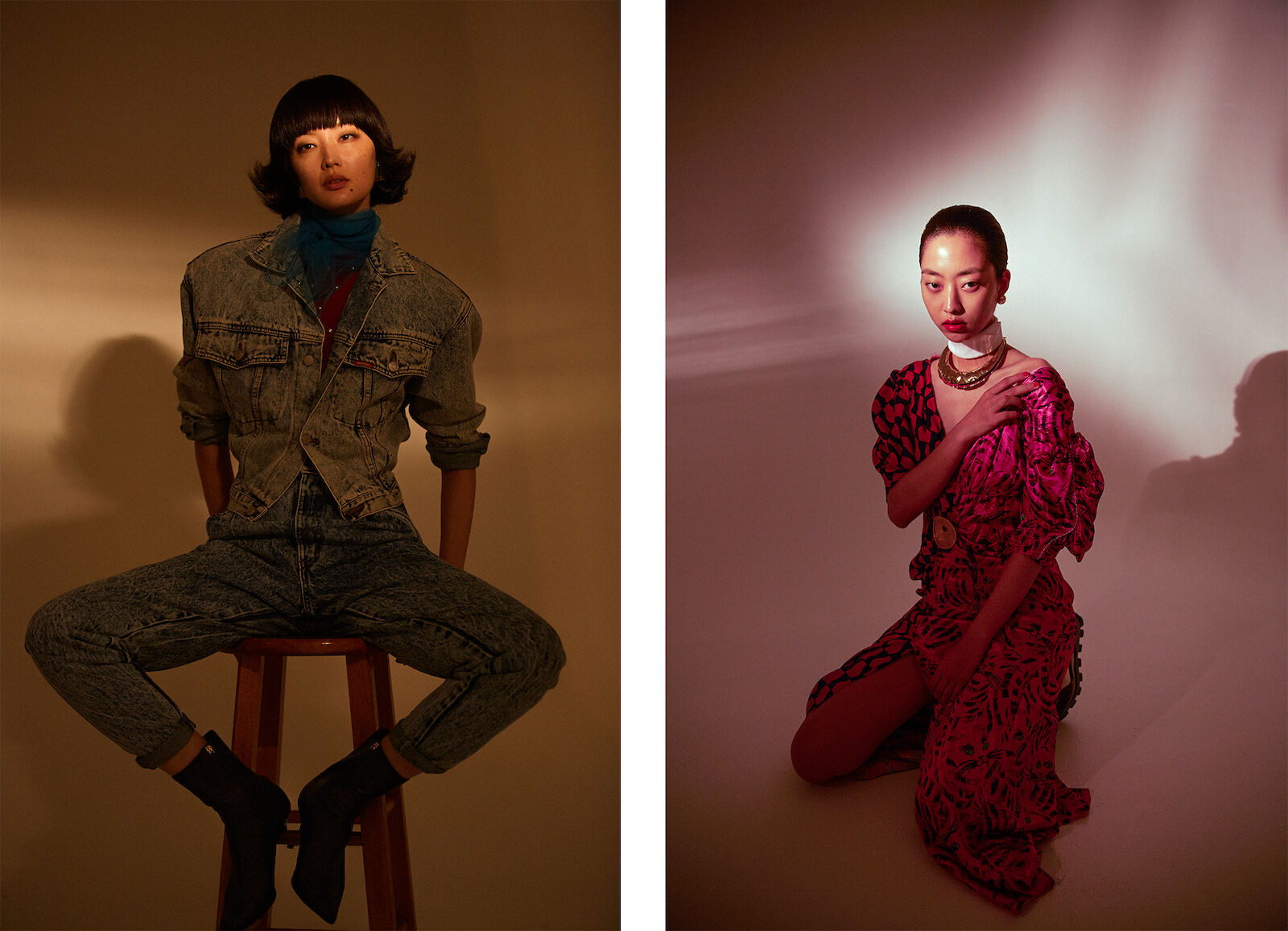 Two Asian women showcase fashion. One sits on a stool in denim, the other kneels in a pink patterned dress, against a warm, gradient backdrop.
