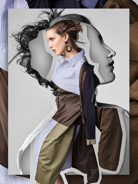 Fashionable woman in a striped shirt and layered coat posing with layered digital art face effects in a studio setting. Editorial fashion