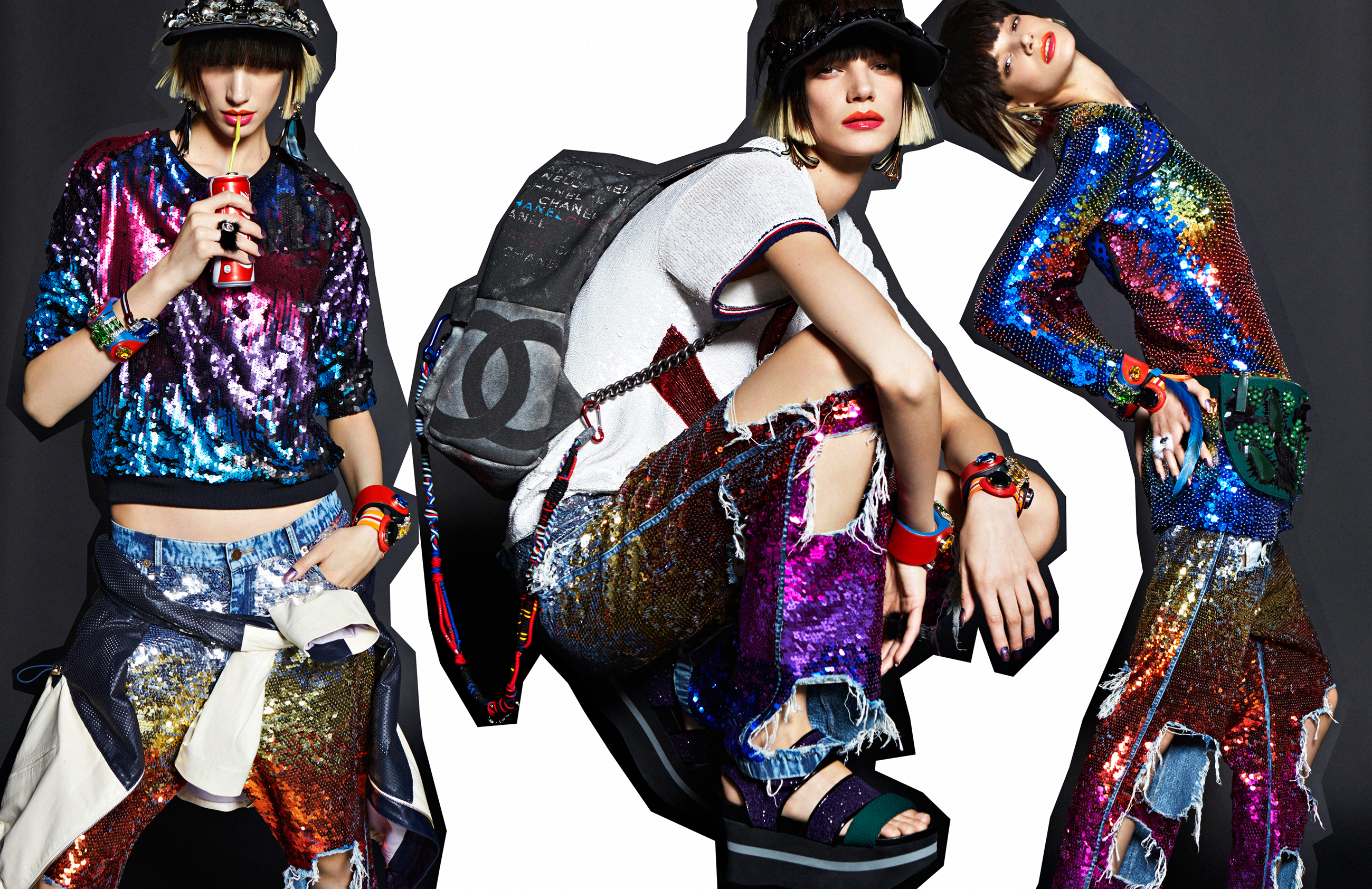 Three young adult women model sequined tops and ripped jeans, posing in a studio against a blended black and white background.