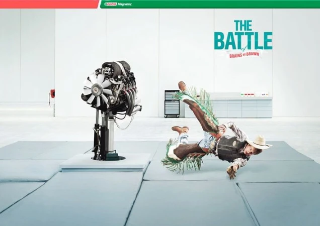 Promotional image contrasts a car engine on a stand and a falling rodeo cowboy on cushioned mats in a white studio setting.