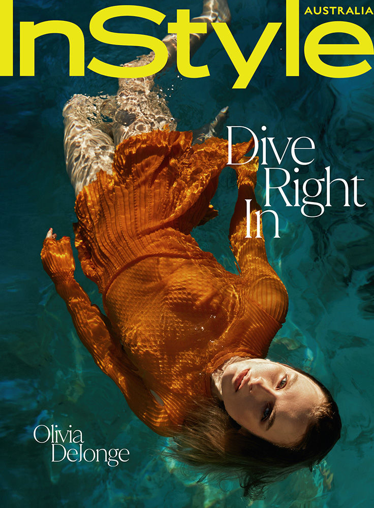InStyle Australia cover featuring Olivia DeJonge in a textured dress underwater, with vibrant turquoise water and magazine text.
