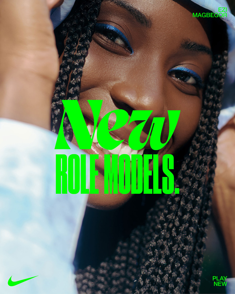Close-up of a smiling Black woman with braided hair, wearing blue eyeshadow. Green text reads 'New Role Models'. Nike logo is visible.
