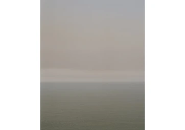 Minimalist landscape photograph showing a calm ocean under an overcast sky by Daniel Mulheran in Sydney.