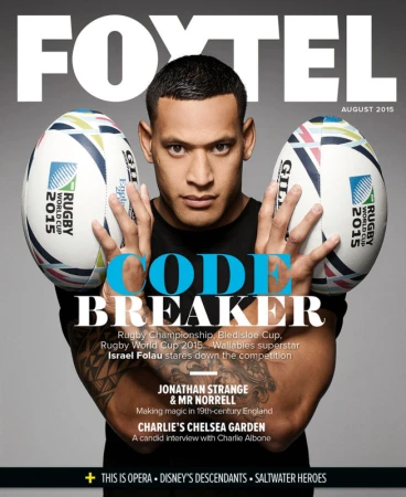 Magazine cover featuring a male athlete holding rugby balls. FOXTEL logo and 'Code Breaker' headline are visible against a gray background.