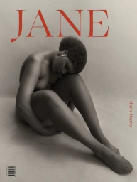 Portrait of a Black woman seated on a neutral seamless backdrop with red editorial magazine typography spelling JANE overhead.