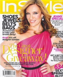 Toni Collette on InStyle magazine cover wearing a one-shoulder pink dress with styled blonde hair.