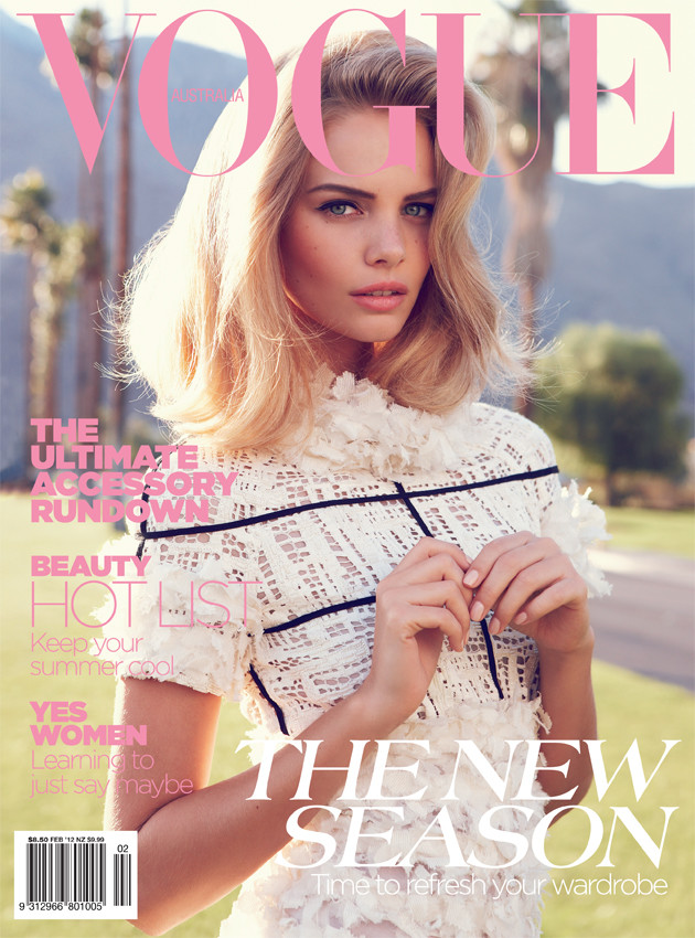 Magazine cover featuring a blonde woman in a white textured top outdoors with palm trees in the background.