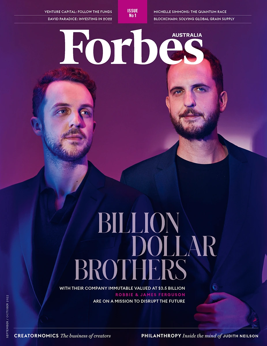 Forbes Australia magazine cover featuring two men in dark suits photographed by Damian Bennett in Sydney.