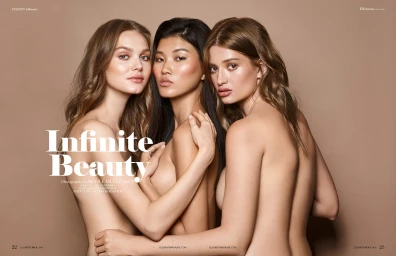 Three female models posing closely together with styled hair and makeup against a solid warm brown background.