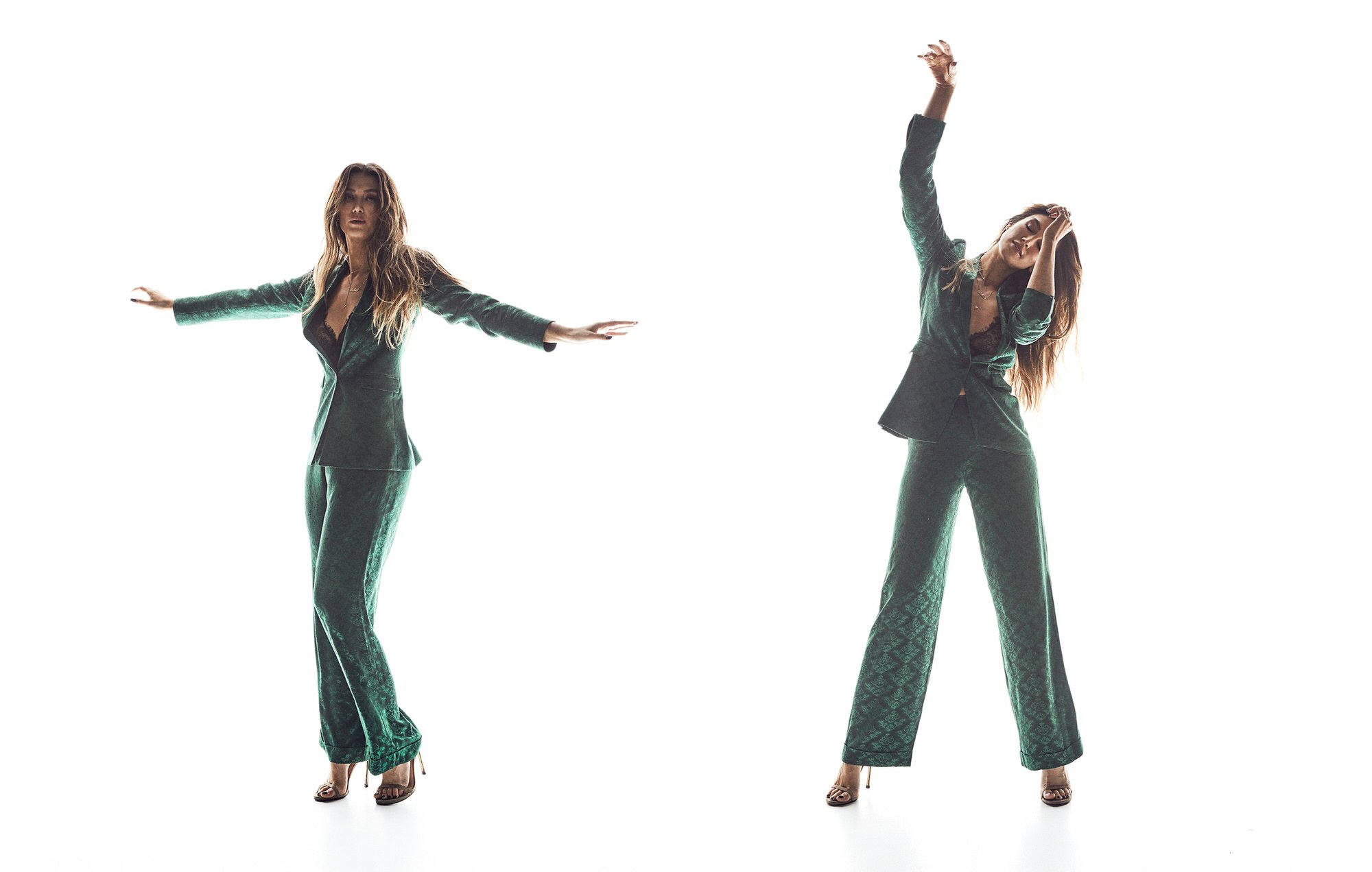 A woman in a green patterned pantsuit strikes two poses against a white backdrop, one with arms out and one with arms raised.