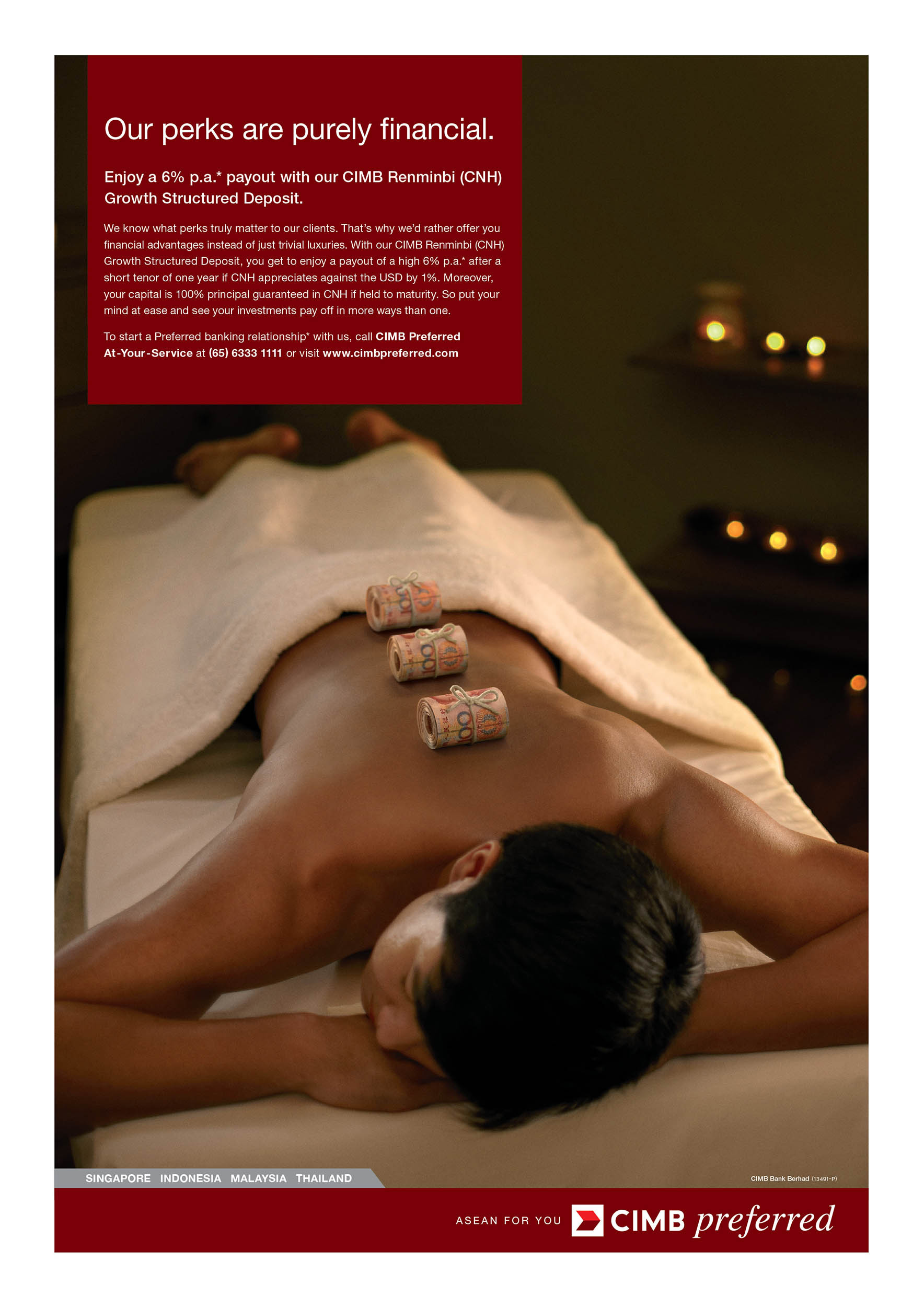 Person lies on massage table with rolled currency on back in CIMB preferred financial services advertising image with soft lighting.