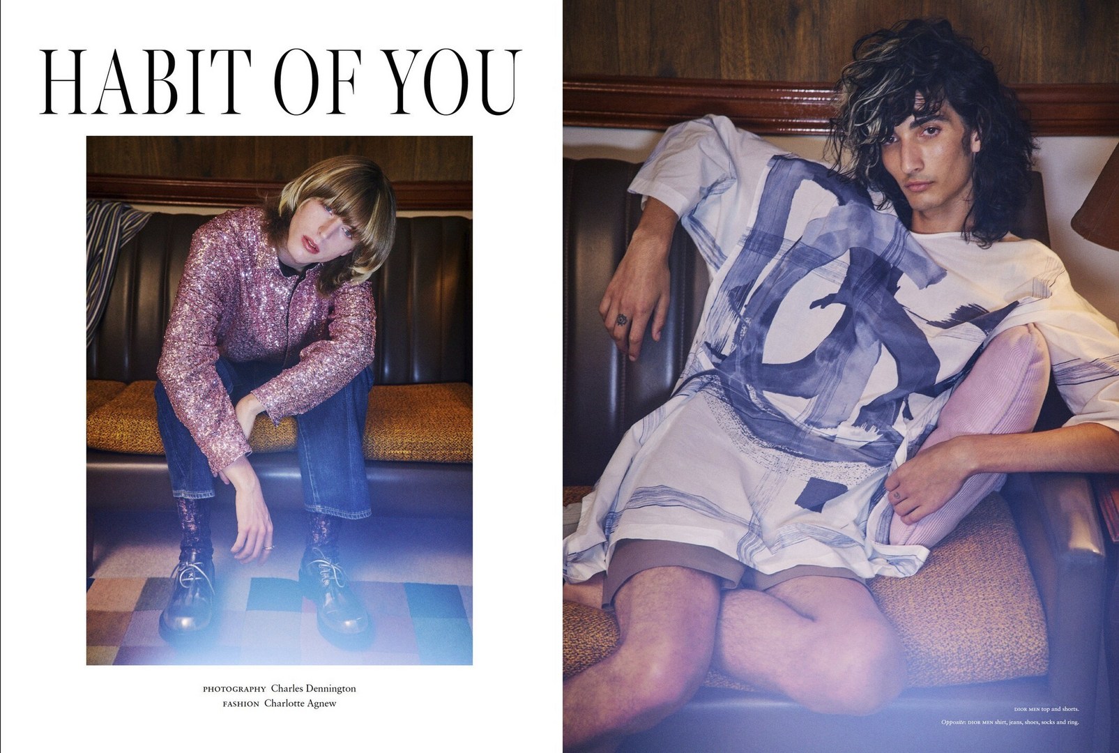 Fashion editorial shot of two young adults in an indoor setting, one seated on a sofa wearing a sequined shirt and the other in a printed shirt.